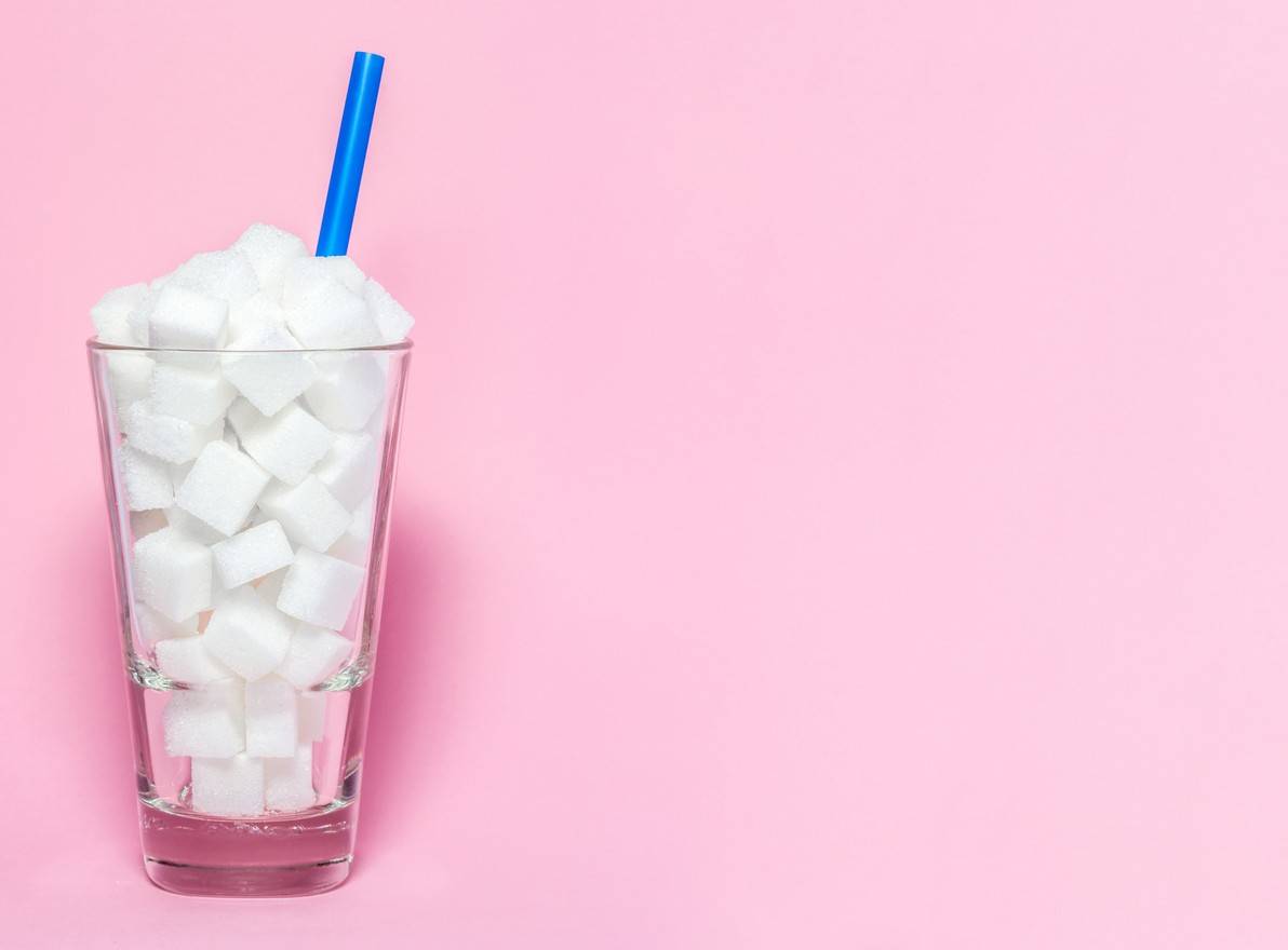 Glass full of sugar cubes - unhealthy diet concept